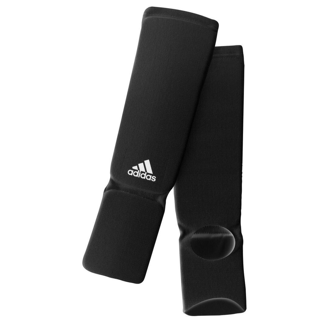 article en promo : Protège-tibia + pied noir chaussette