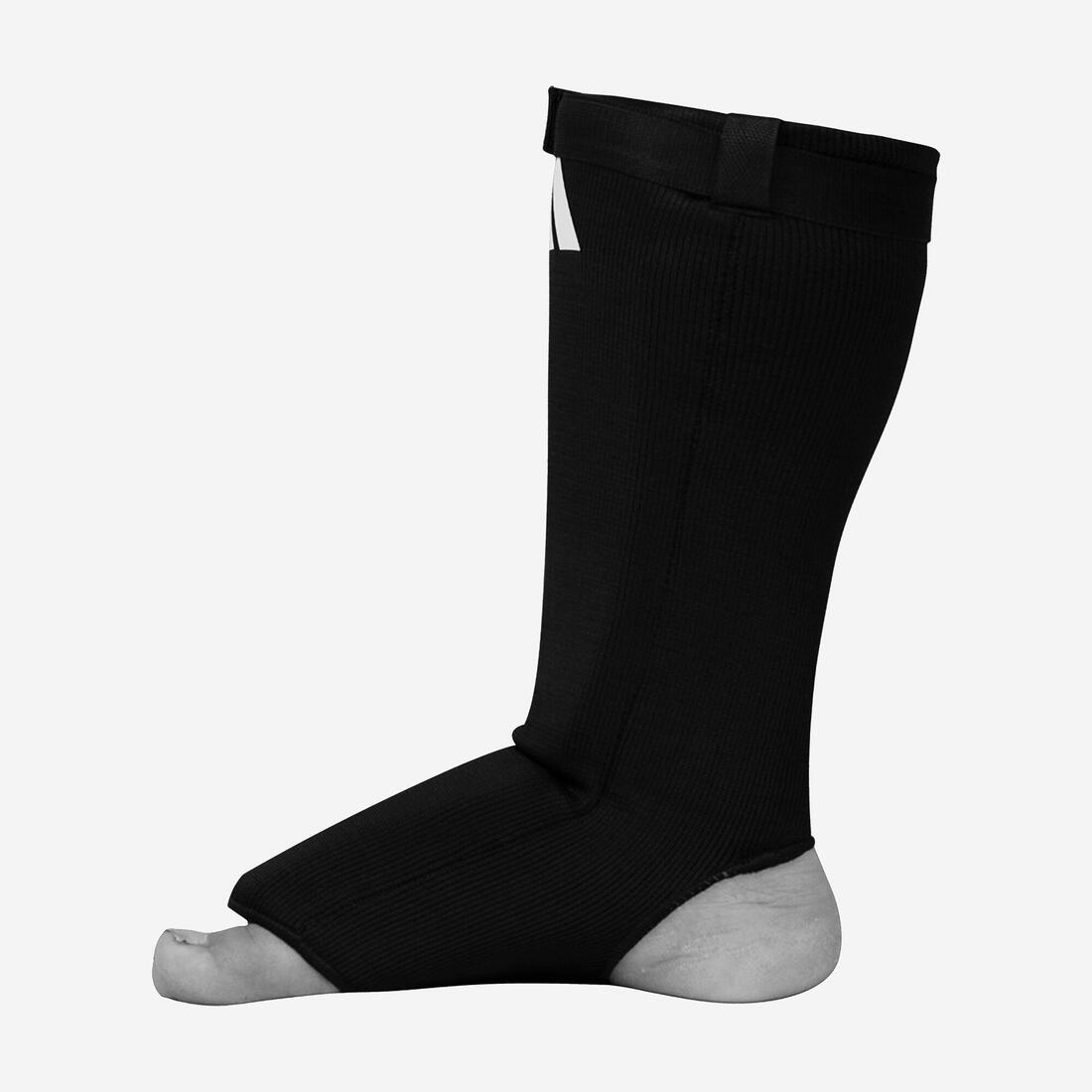 article en promo : Protège-tibia + pied noir chaussette